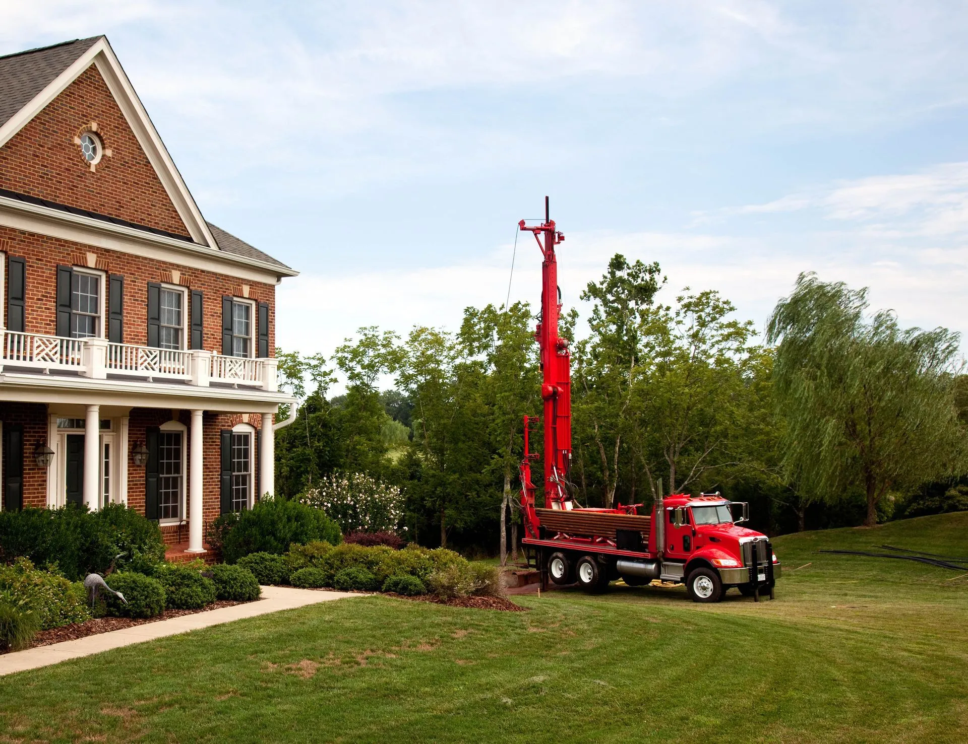 Professional well drilling crew working on site