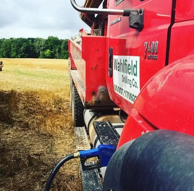 A Wahlfield Drilling rig truck parked up at the edge of a harvested field.