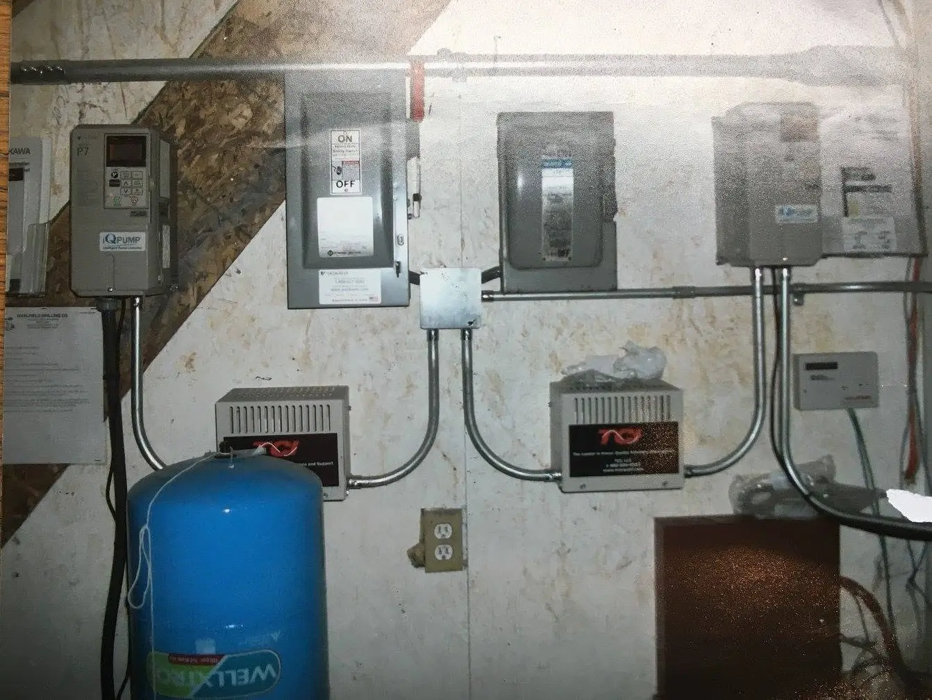 Control panel, switch gear and pressure tank on a completed installation.