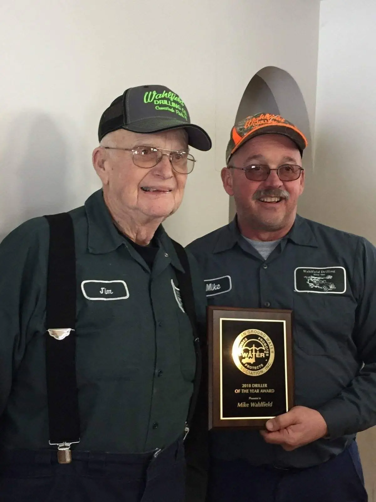 Mike Wahlfield with the Michigan Ground Water Association Driller of the Year award.