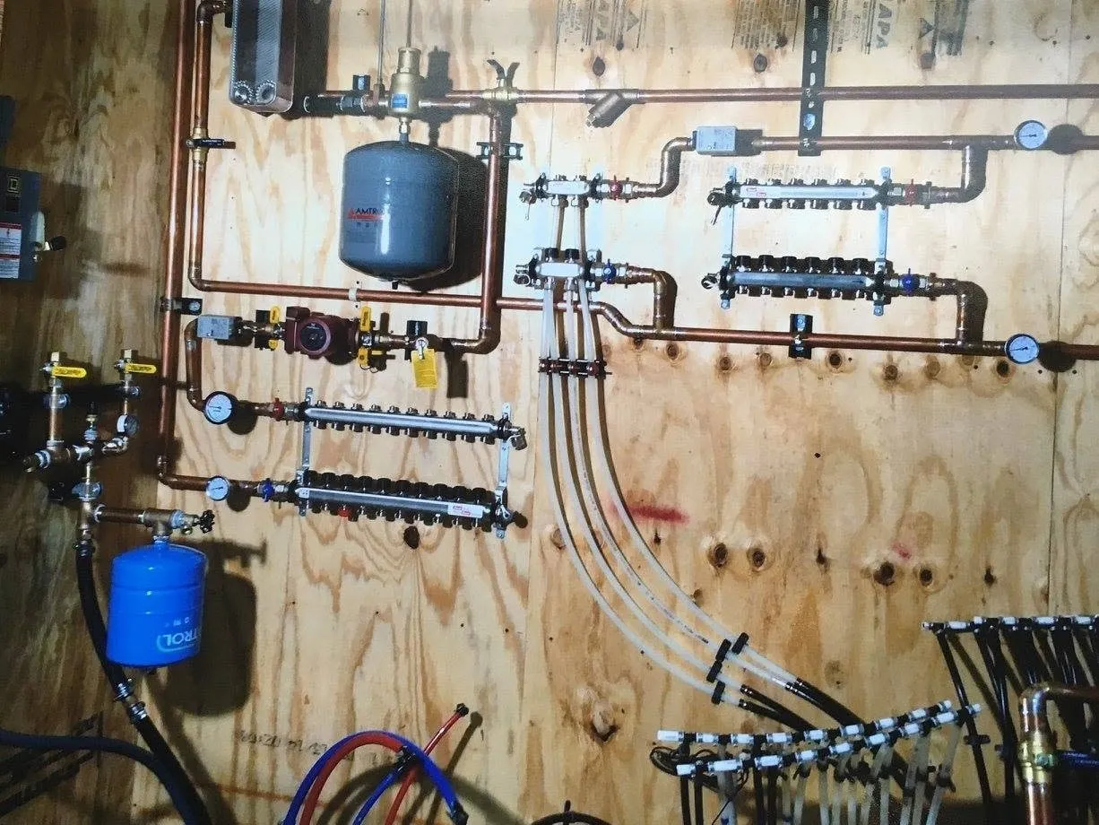 A finished pressure tank and manifold, plumbed and labelled.