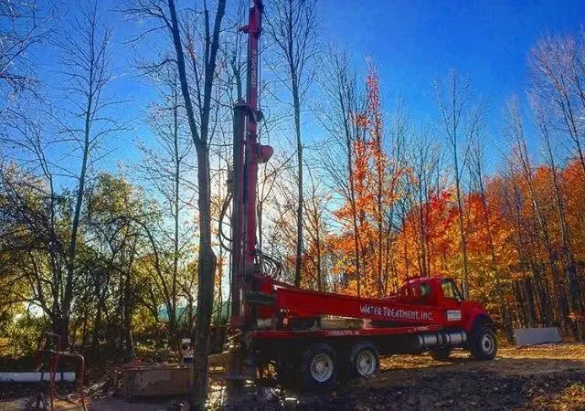 A rig set up against an autumn treeline in West Michigan.