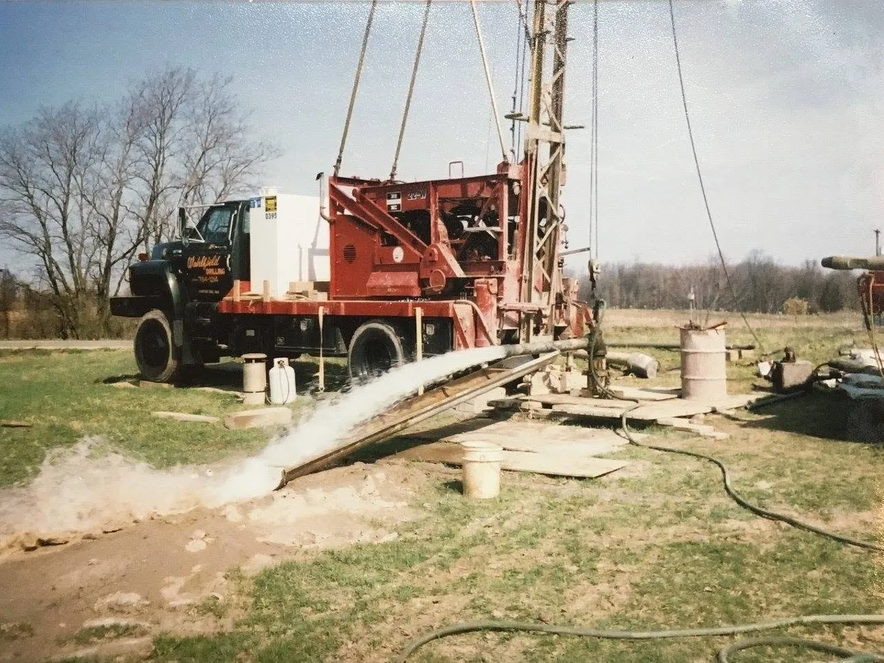 Water running at the wellhead while a new well is developed.